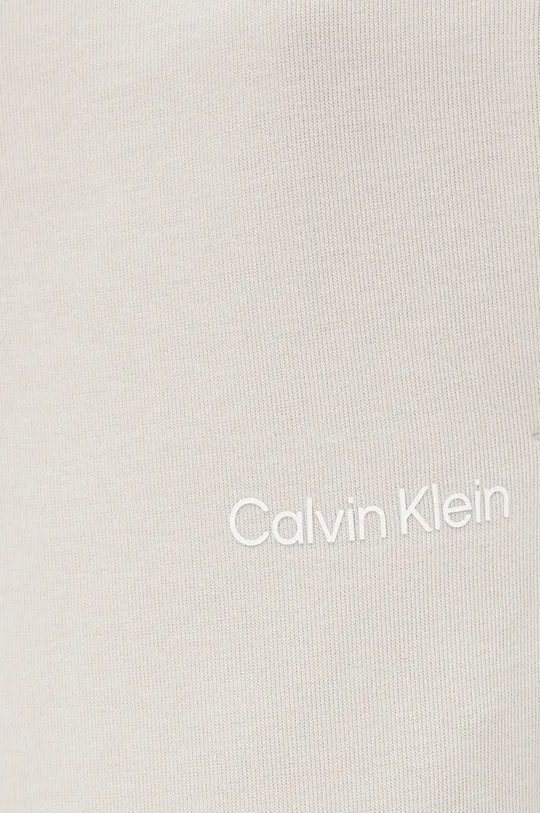 Calvin Klein spodnie  74 % Bawełna, 22 % Poliester, 4 % Elastan