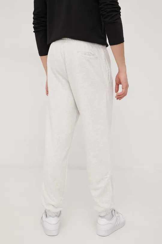 New Balance spodnie dresowe bawełniane UP21500SAH jasny szary