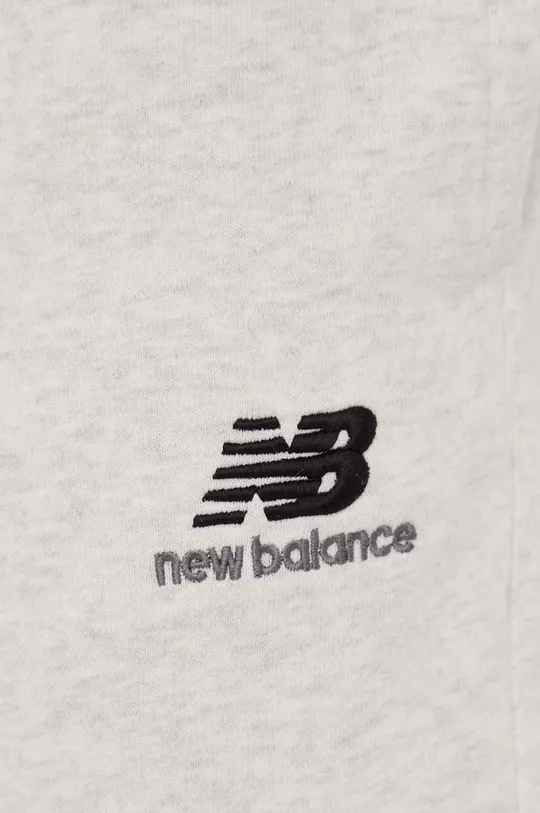 New Balance spodnie dresowe bawełniane UP21500SAH 100 % Bawełna