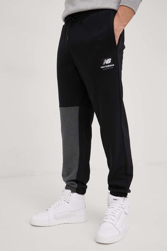 New Balance spodnie dresowe bawełniane MP21550BK czarny