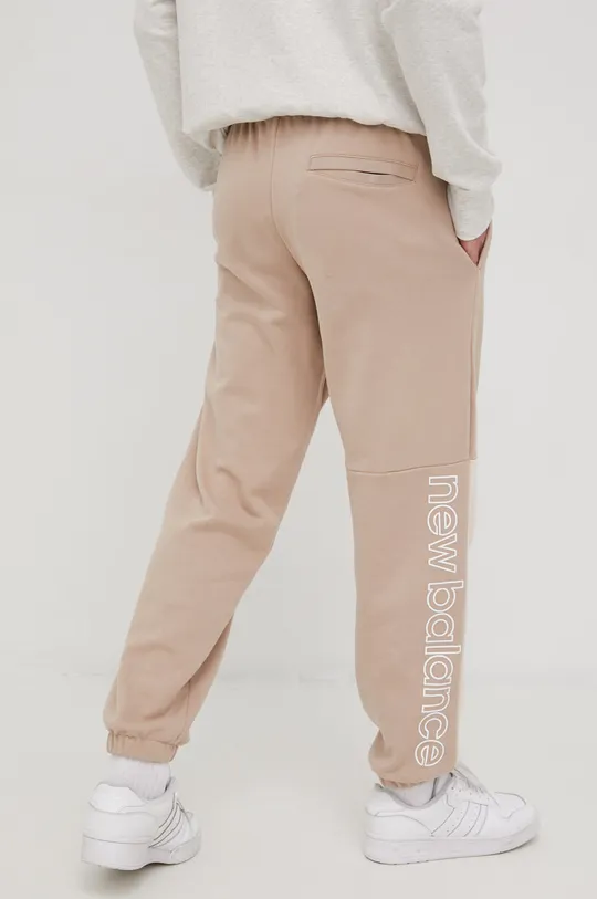 beżowy New Balance spodnie dresowe bawełniane MP21550MDY Męski