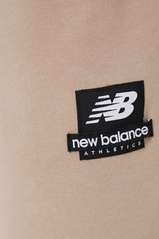 beżowy New Balance spodnie dresowe bawełniane MP21550MDY