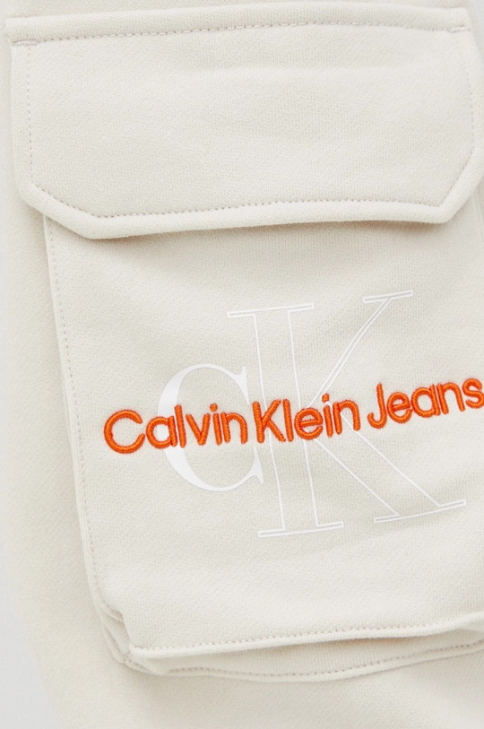 bež Pamučni donji dio trenirke Calvin Klein Jeans