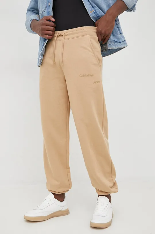 Nohavice Calvin Klein Jeans béžová