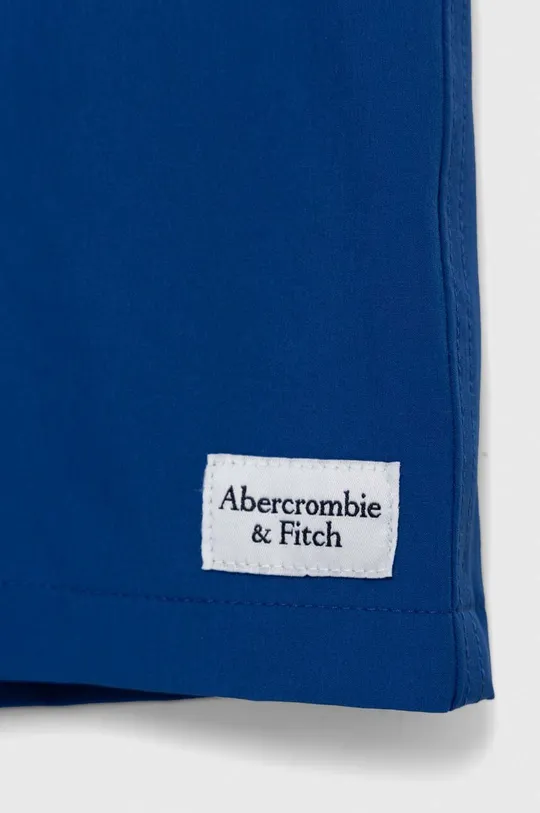 Abercrombie & Fitch gyerek úszó rövidnadrág  Jelentős anyag: 91% poliészter, 9% elasztán Bélés: 100% poliészter Más anyag: 90% poliészter, 10% elasztán