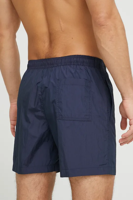 Kopalne kratke hlače Calvin Klein  Glavni material: 60 % Poliester, 40 % Poliamid Podloga: 100 % Poliester