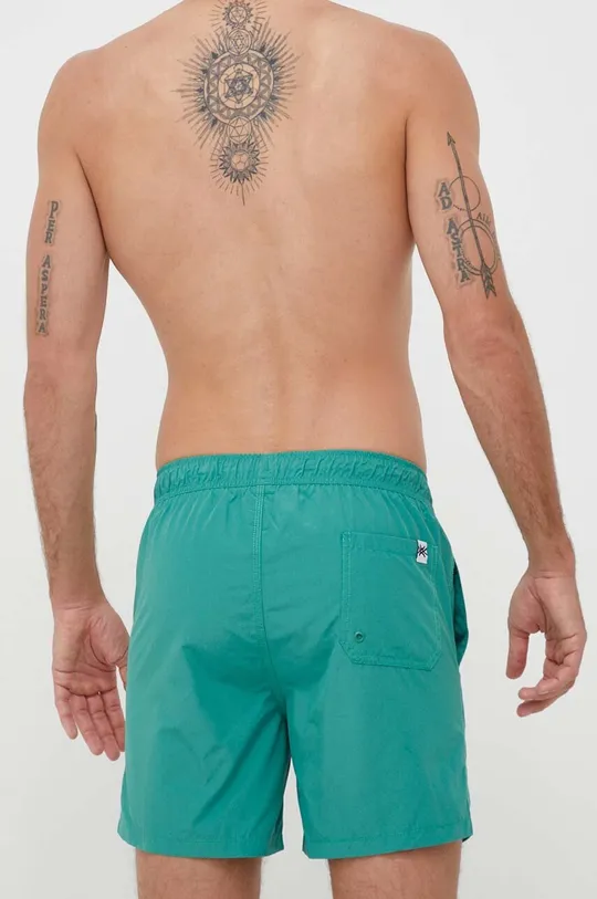 Plavkové šortky United Colors of Benetton  Základná látka: 80 % Polyester, 20 % Bavlna Podšívka: 100 % Polyester