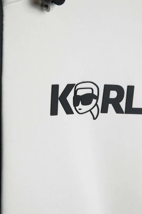 Otroški pulover Karl Lagerfeld  Glavni material: 67 % Poliamid, 33 % Elastan Podloga: 90 % Poliester, 10 % Elastan