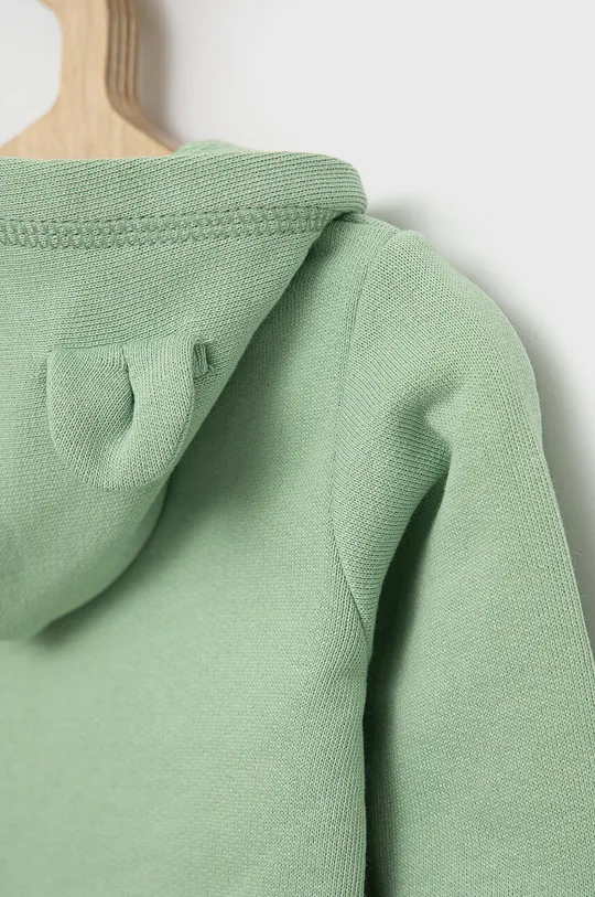 Bombažen pulover za dojenčka United Colors of Benetton  Glavni material: 100 % Bombaž Patent: 95 % Bombaž, 5 % Elastan