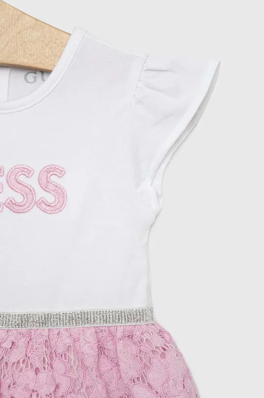 Φόρεμα μωρού Guess  Υλικό 1: 95% Βαμβάκι, 5% Σπαντέξ Υλικό 2: 38% Βαμβάκι, 32% Βισκόζη, 30% Πολυαμίδη Υλικό 3: 100% Βαμβάκι