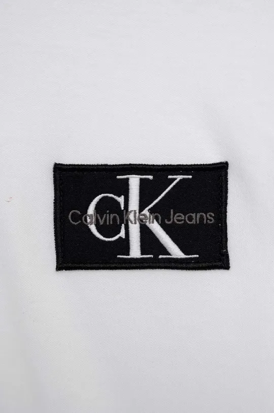 Otroška bombažna majica z dolgimi rokavi Calvin Klein Jeans bela