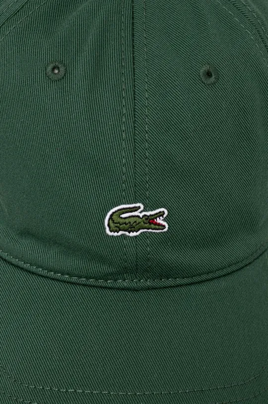 Памучна шапка с козирка Lacoste зелен