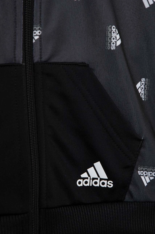 Detská tepláková súprava adidas I BLUV SHINY  Základná látka: 100 % Recyklovaný polyester Elastická manžeta: 95 % Recyklovaný polyester, 5 % Elastan