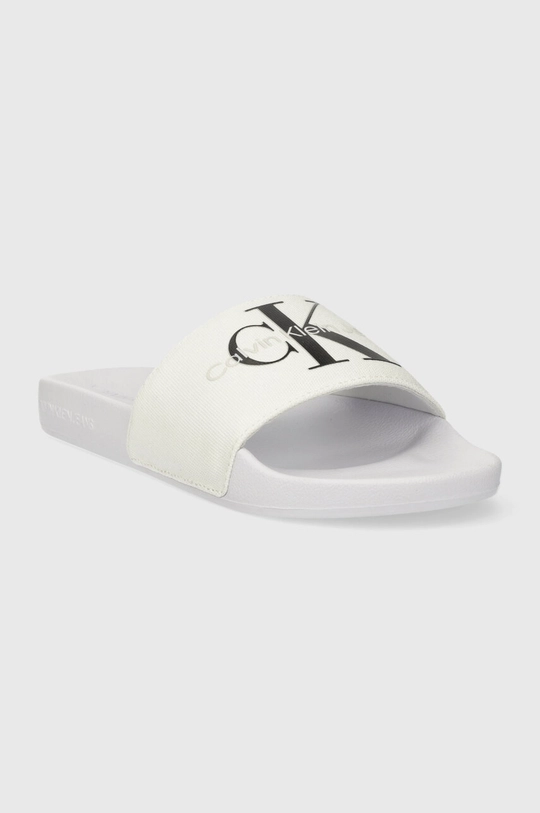 Natikače Calvin Klein Jeans SLIDE MONOGRAM CO Vanjski dio: Tekstilni materijal Unutrašnji dio: Sintetički materijal, Tekstilni materijal Potplat: Sintetički materijal