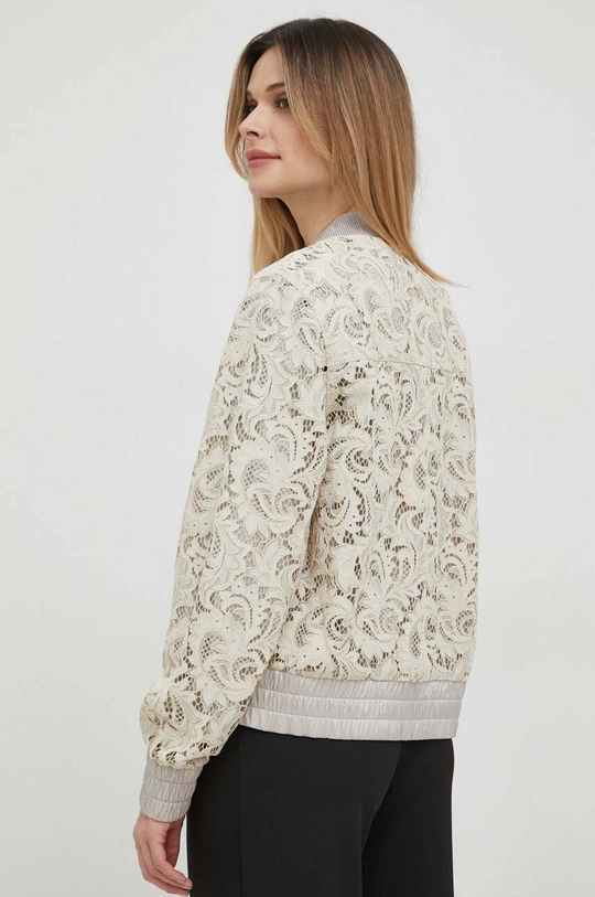 Obojstranná bunda bomber Guess  Základná látka: 42 % Polyamid, 36 % Viskóza, 22 % Bavlna Podšívka: 56 % Polyester, 44 % Polyamid