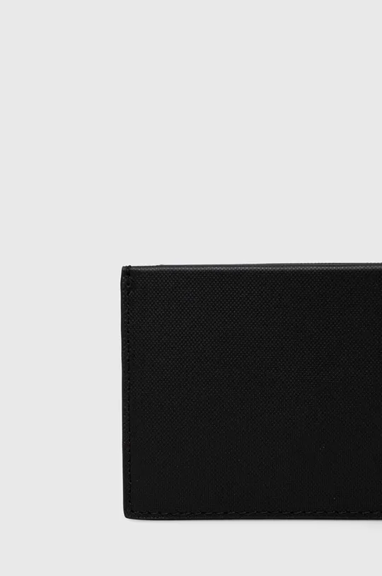 Шкіряний гаманець Calvin Klein  Основний матеріал: 100% Коров'яча шкіра Підкладка: 100% Перероблений поліестер