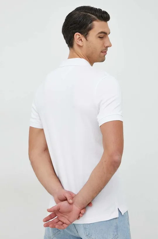 Polo tričko Guess  Hlavní materiál: 95 % Bavlna, 5 % Elastan Ozdobné prvky: 100 % Bavlna Aplikace: 100 % Polyester