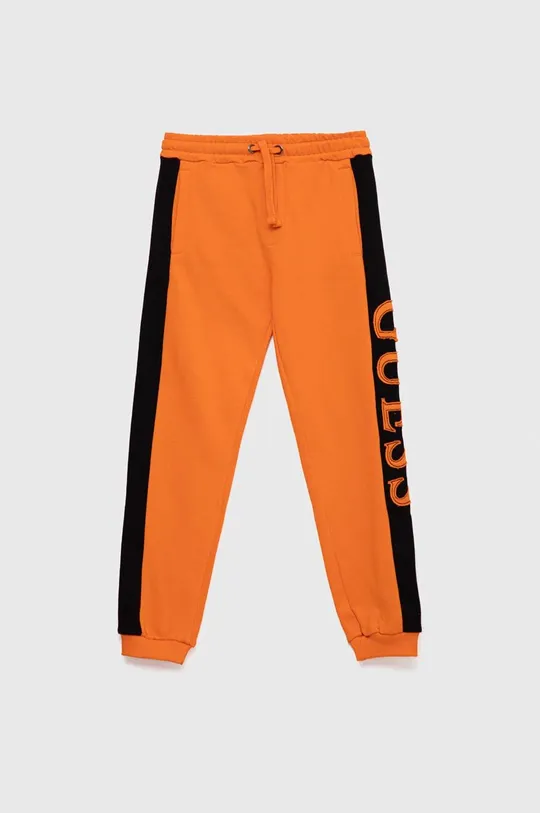 помаранчевий Дитячі бавовняні штани Guess Для хлопчиків