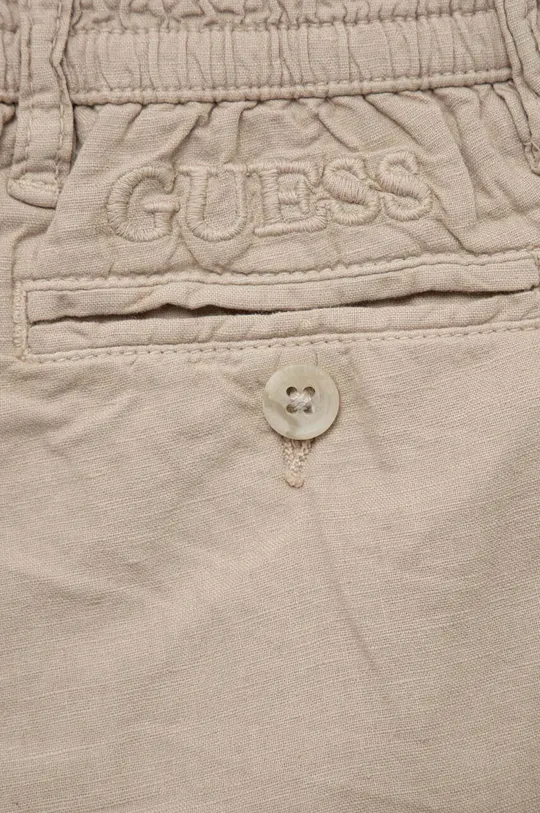 Παιδικό λινό παντελόνι Guess  Κύριο υλικό: 55% Λινάρι, 45% Βαμβάκι Φόδρα: 100% Βαμβάκι
