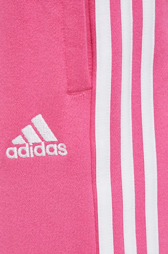 рожевий Бавовняні спортивні штани adidas