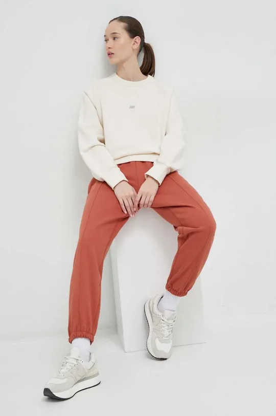 New Balance spodnie dresowe bawełniane czerwony