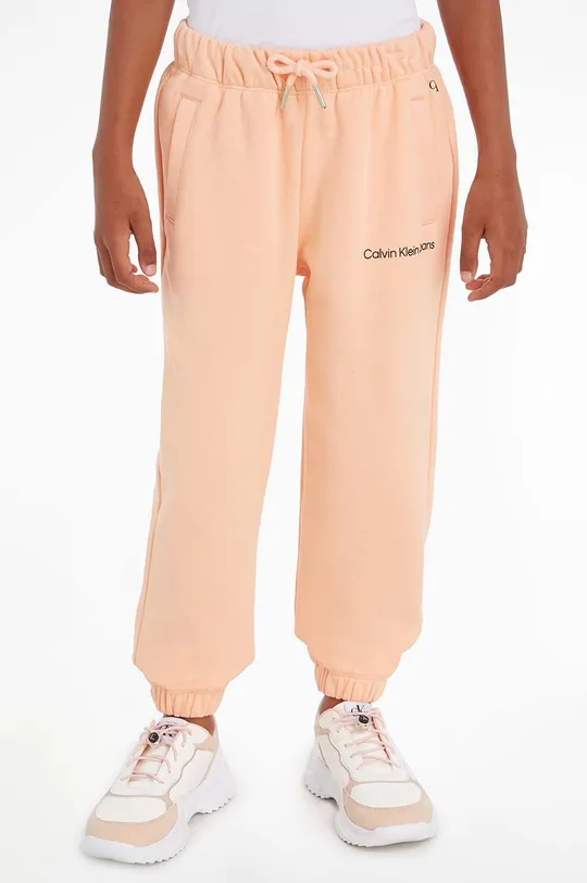 pomarańczowy Calvin Klein Jeans spodnie dresowe dziecięce Dziewczęcy