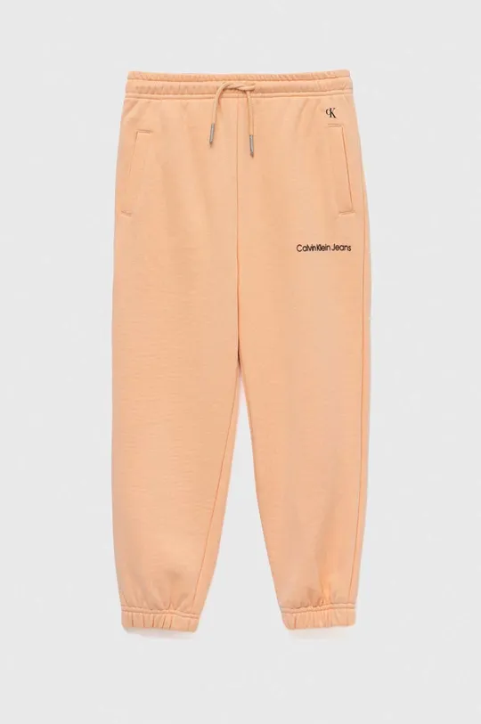 Calvin Klein Jeans spodnie dresowe dziecięce pomarańczowy