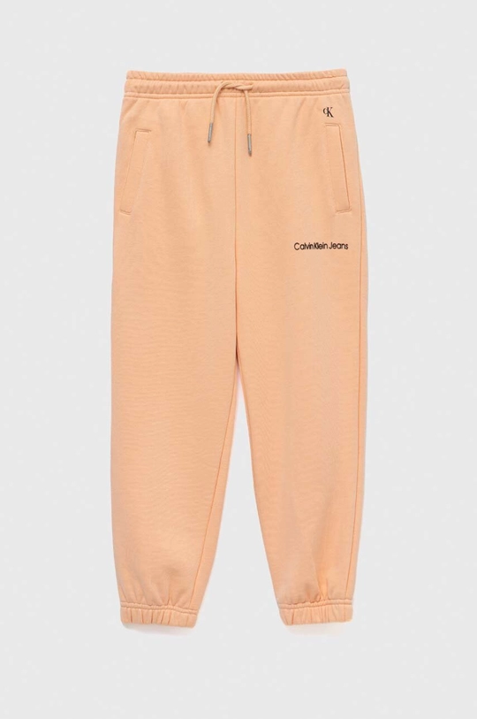 Detské tepláky Calvin Klein Jeans oranžová