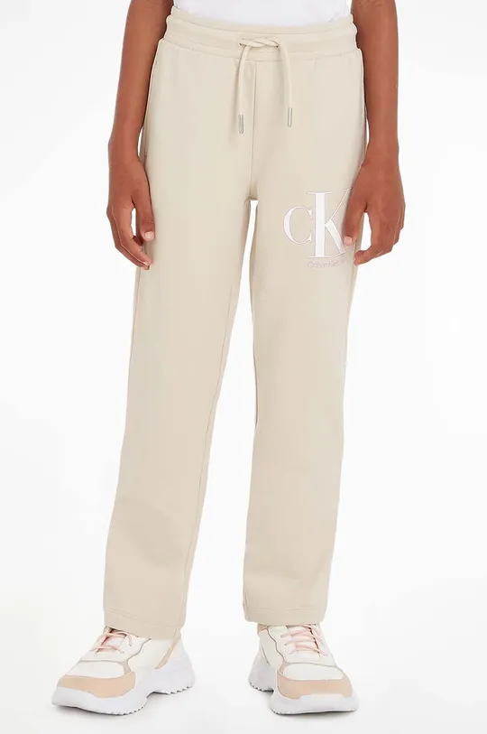 бежевий Дитячі спортивні штани Calvin Klein Jeans Для дівчаток