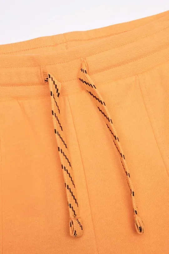 помаранчевий Дитячі бавовняні штани Coccodrillo