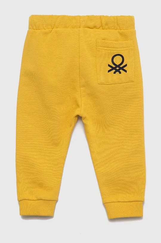 United Colors of Benetton spodnie dresowe bawełniane dziecięce żółty