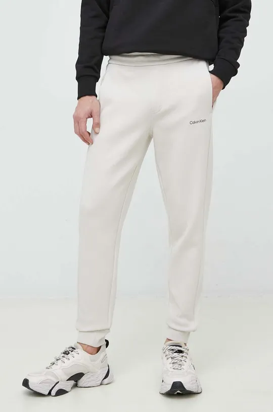 beżowy Calvin Klein spodnie dresowe Męski