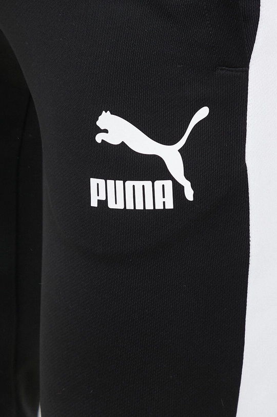 Spodnji del trenirke Puma  Glavni material: 59 % Poliester, 41 % Bombaž Podloga žepa: 100 % Bombaž