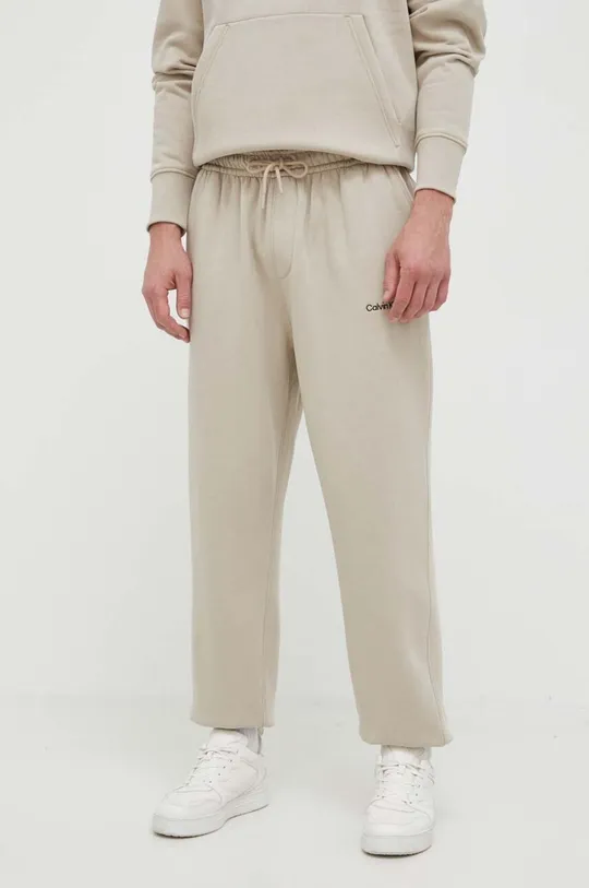 beżowy Calvin Klein Jeans spodnie dresowe Męski