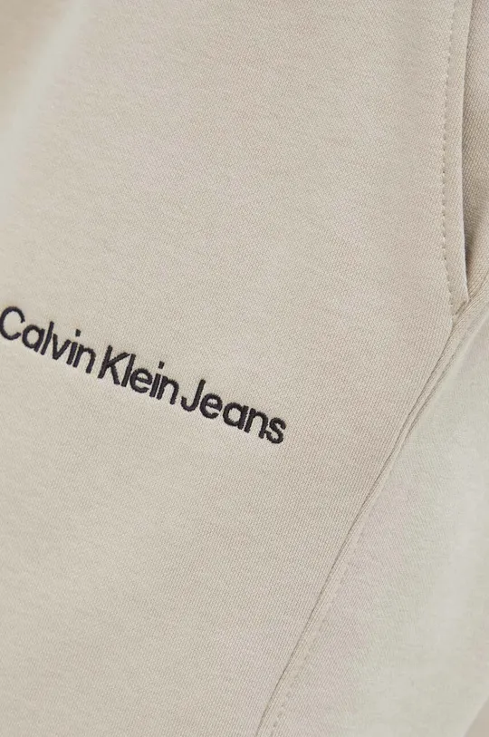 бежевий Спортивні штани Calvin Klein Jeans