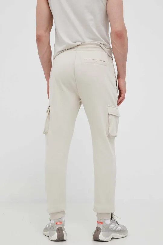 Ellesse spodnie dresowe beżowy