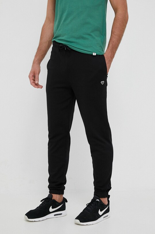 Хлопковые спортивные штаны Hummel цвет чёрный с аппликацией | ANSWEAR.ua