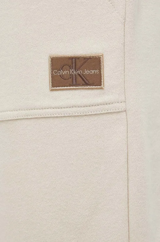beżowy Calvin Klein Jeans spodnie dresowe bawełniane