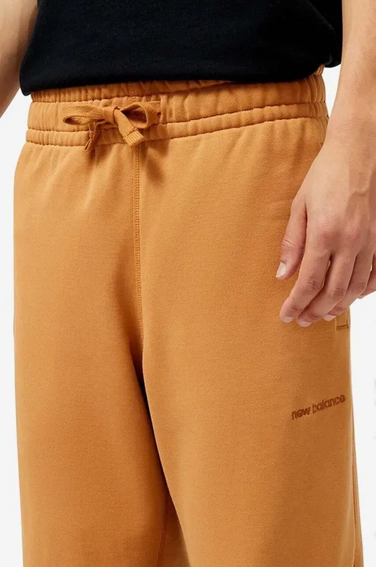 оранжевый Хлопковые спортивные штаны New Balance