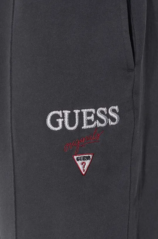 Bombažen spodnji del trenirke Guess Originals Go Baker Logo Jogger Unisex
