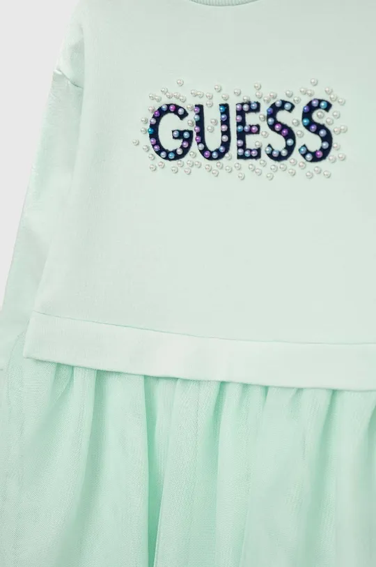 Φόρεμα μωρού Guess  Κύριο υλικό: 95% Βαμβάκι, 5% Σπαντέξ Φινίρισμα: 100% Πολυεστέρας