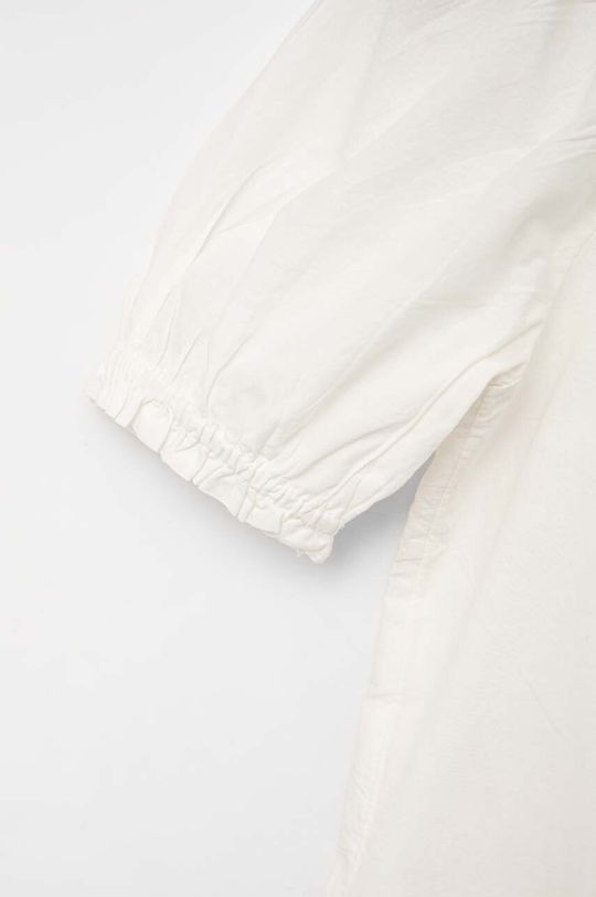 Dětské bavlněné šaty GAP  Hlavní materiál: 100 % Bavlna Podšívka: 100 % Bavlna Ozdobné prvky: 100 % Polyester