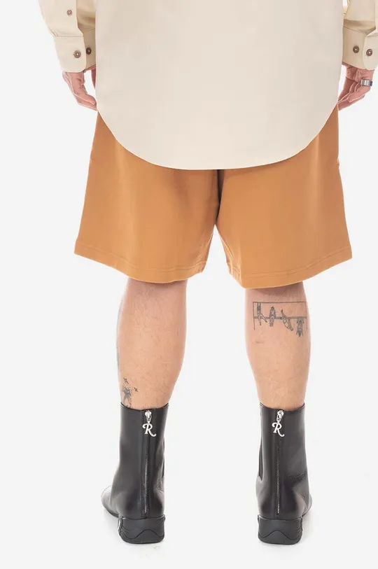 Памучен къс панталон New Balance оранжев