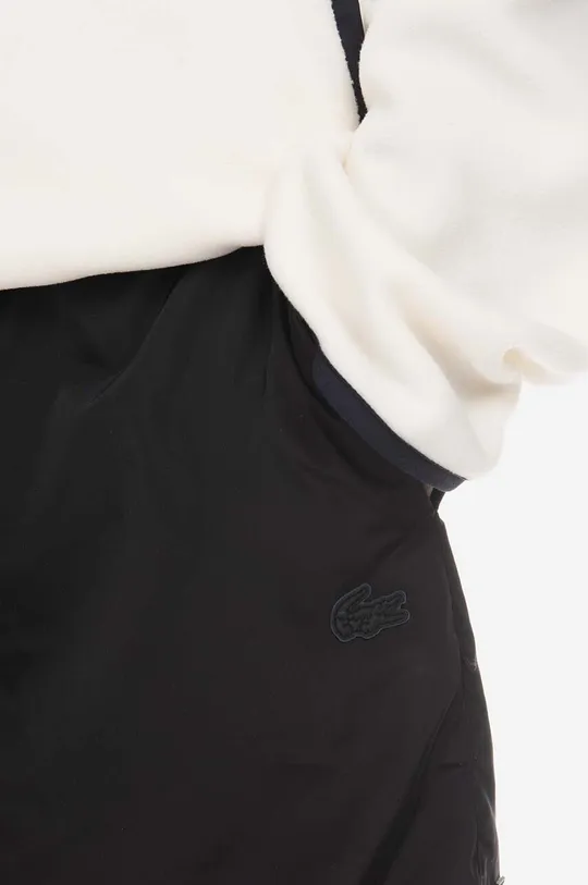 black Lacoste shorts