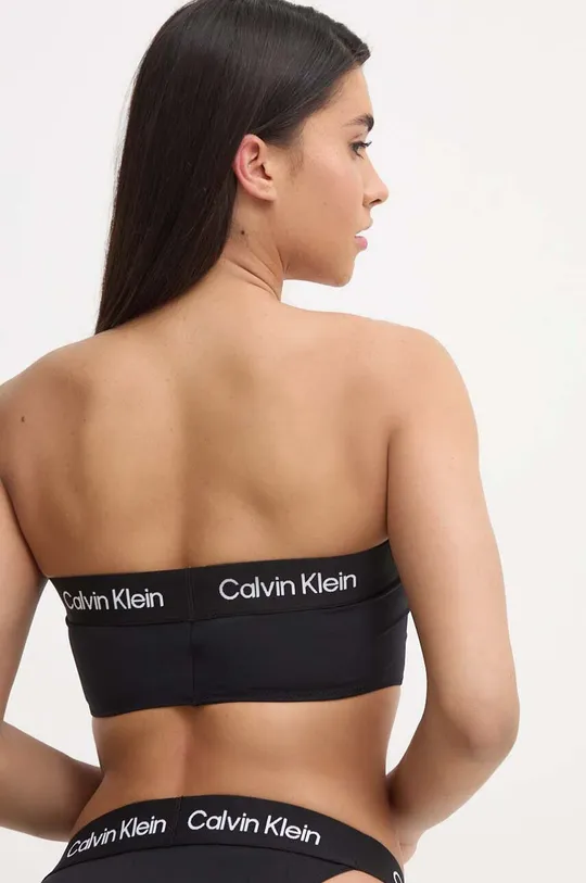 Купальний бюстгальтер Calvin Klein Основний матеріал: 80% Поліамід, 20% Еластан Підкладка: 92% Поліестер, 8% Еластан Стрічка: 49% Поліамід, 41% Поліестер, 10% Еластан