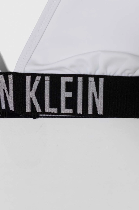 Dječji dvodijelni kupaći kostim Calvin Klein Jeans Temeljni materijal: 78% Poliamid, 22% Elastan Postava: 92% Poliester, 8% Elastan Drugi materijali: 86% Poliester, 14% Elastan