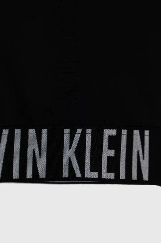 Dječji dvodijelni kupaći kostim Calvin Klein Jeans Temeljni materijal: 78% Poliamid, 22% Elastan Postava: 92% Poliester, 8% Elastan Traka: 86% Poliester, 14% Elastan