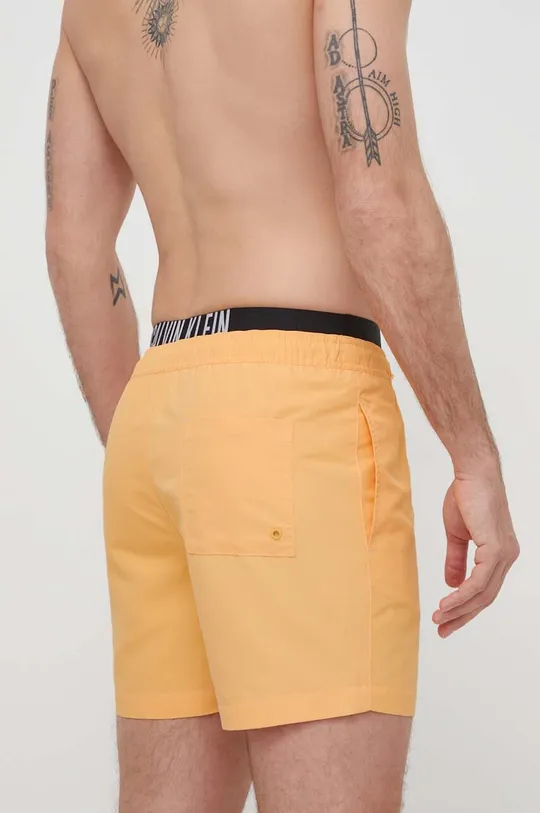 Plavkové šortky Calvin Klein oranžová
