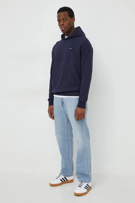 Bombažen pulover Calvin Klein mornarsko modra