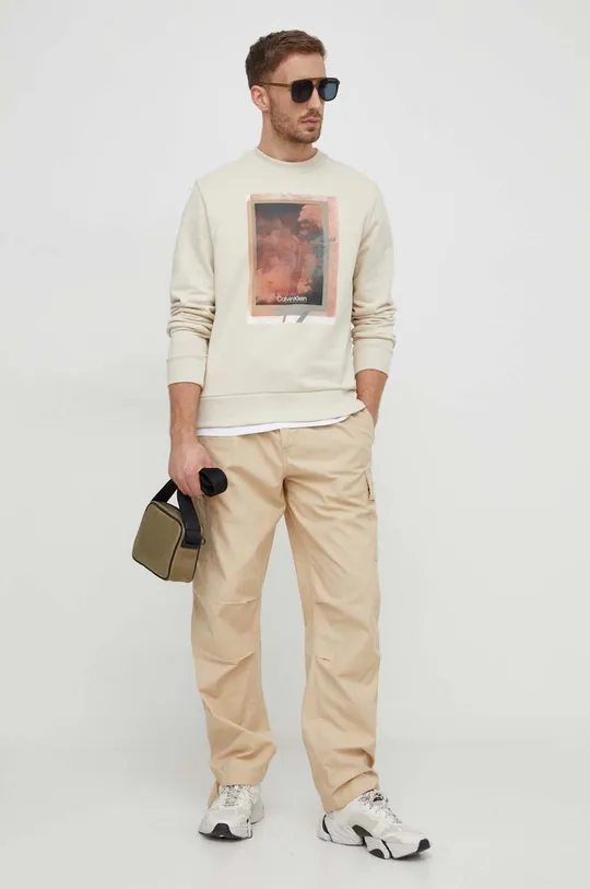 Bombažen pulover Calvin Klein bež